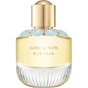 Clear glass perfume bottle with a fluted base, topped with a gold cap and adorned with light blue petals, containing a golden liquid labeled "GIRL of NOW" by Elie Saab.