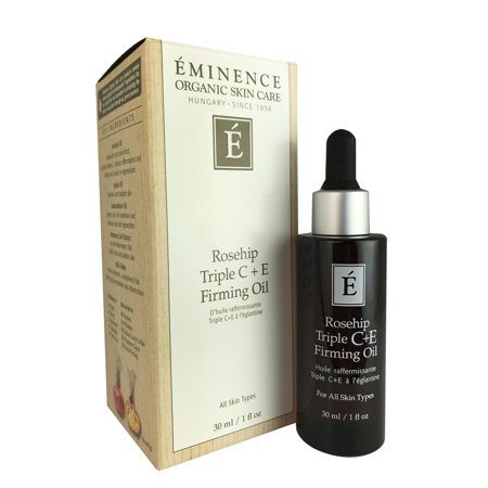 Eminence Rosehip Triple C Plus E Firming Oil in a dark glass dropper bottle, featuring a black cap, alongside a beige box with green and gold accents, labeled for all skin types.