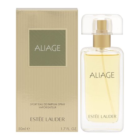 Clear glass bottle with a gold cap, containing light yellow perfume, alongside a beige box featuring green accents and the text "ALIAGE" and "ESTÉE LAUDER."