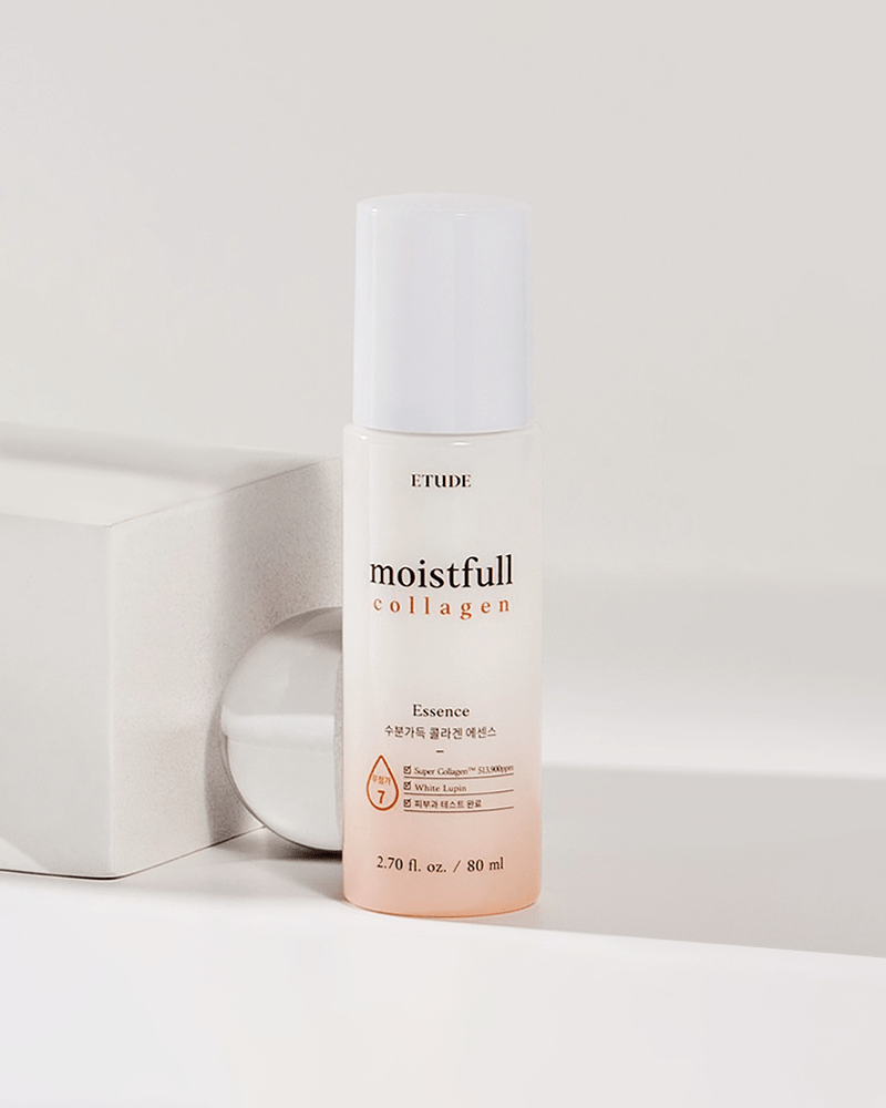Clear bottle of Etude House Moistfull Collagen Essence, 80ml, featuring a white cap, gradient peach to clear design, and labeled with "moistfull collagen" in elegant font.
