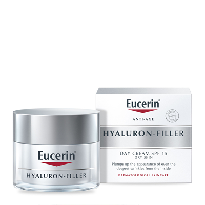 Eucerin® Anti-Age Hyaluron-Filler Day Cream in a clear jar with a silver lid, accompanied by a white box featuring red and blue branding, labeled for dry skin with SPF 15 and UVA protection.