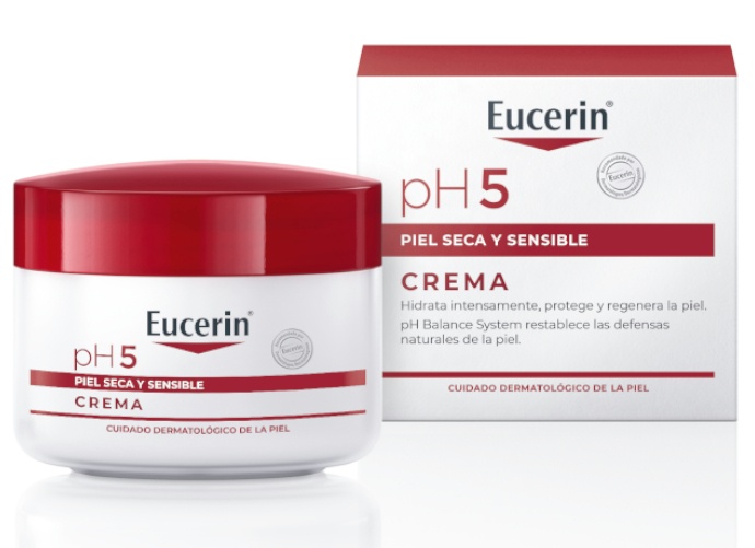 White cream jar with a red lid labeled "Eucerin pH5" for sensitive skin, accompanied by a matching white and red box featuring product details in Spanish.