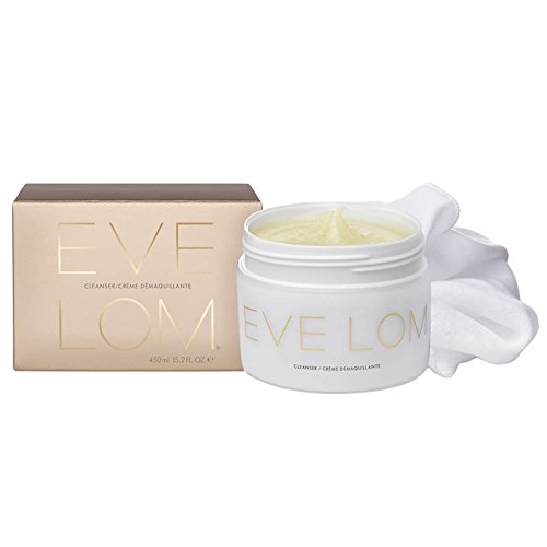 White jar with a gold lid labeled "EVE LOM" beside a beige box, both featuring elegant typography; includes a soft white cloth for application.