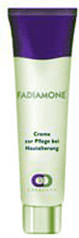 Fadiamone Creaderm cream in a 30 ml tube, featuring a purple cap and a light green body, labeled for skin care with a sleek design.