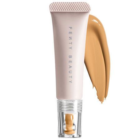 Fenty Beauty Bright Fix Eye Brightener in Almond Butter features a sleek tube with a soft pink cap and a creamy, tan swatch beside it, ideal for brightening the under-eye area.
