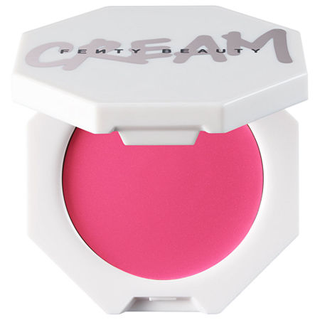 Bright pink cream blush in a hexagonal white compact with "FENTY BEAUTY" printed on the lid, featuring a smooth texture and lightweight design.