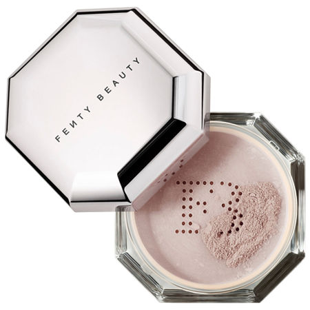 Fenty Beauty Pro Filt'R Instant Retouch Setting Powder in Lavender, featuring a sleek octagonal container with a reflective silver lid and fine lavender powder inside.