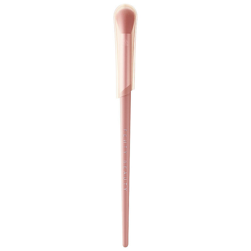 Fenty Beauty Tapered Blending Brush 210 features a soft, tapered brush head and a sleek, light pink handle with "Fenty Beauty" embossed in white.