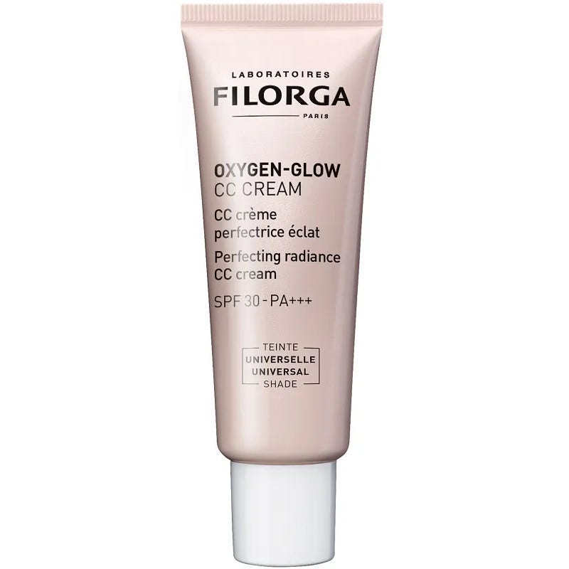 Light pink tube of Filorga Oxygen CC Cream-Glow, 40 ml, featuring a sleek design, labeled with "CC Cream" and "SPF 30-PA+++" for radiant skin.