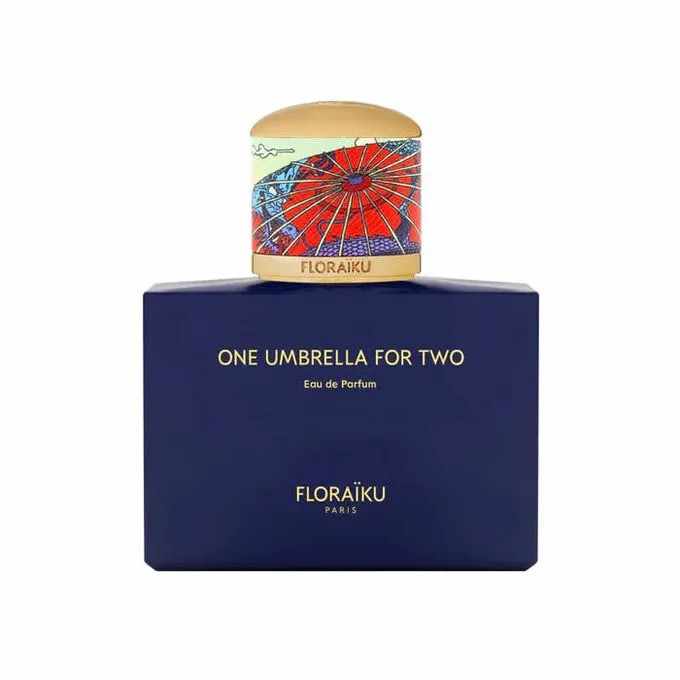 Floraïku One Umbrella for Two Eau De Parfum features a deep blue rectangular bottle with a colorful, artistic cap depicting a red umbrella, labeled with gold text.
