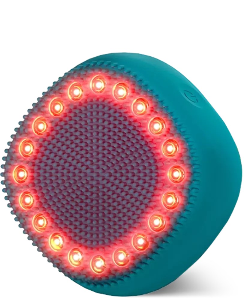 Teal LED hair strengthening scalp massager featuring a textured surface with red lights around the edge, designed to stimulate hair follicles.