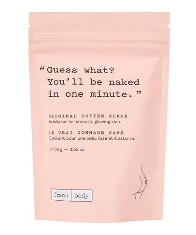 Light pink packaging with a matte finish featuring the text "Guess what? You’ll be naked in one minute." and "Original Coffee Scrub" in bold, with a minimalist design.