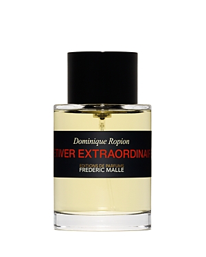 Clear glass bottle with a black cap, featuring a label that reads "Vetiver Extraordinaire" in bold red and black text, containing a light yellow fragrance.