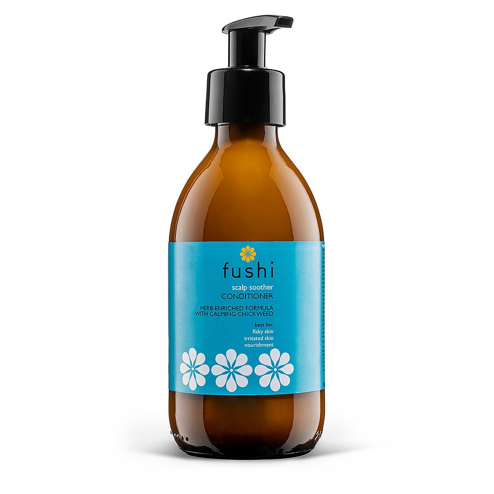 Amber glass bottle with a black pump top, featuring a bright blue label adorned with white flowers, labeled "Fushi Herbal Soothing Leather Balm."