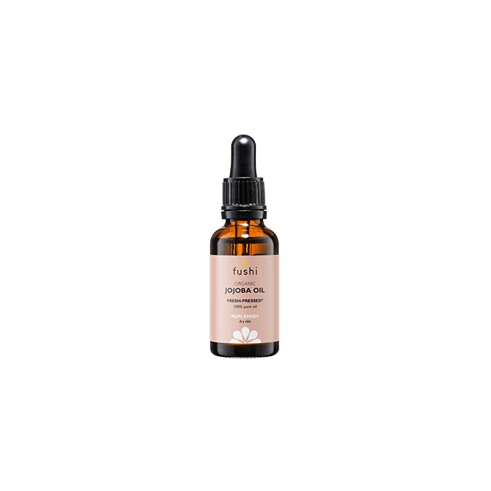 Amber glass bottle with a black dropper cap, labeled "Fushi Organic Jojoba Oil 30ml," featuring a light pink and white design, highlighting its benefits for skin and hair.