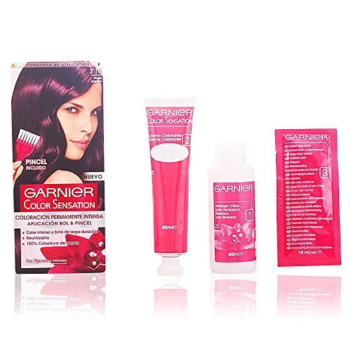Permanent dye kit from Garnier Color Sensation featuring a pink tube, a developer bottle, and a color cream packet, all in a vibrant pink and black box.