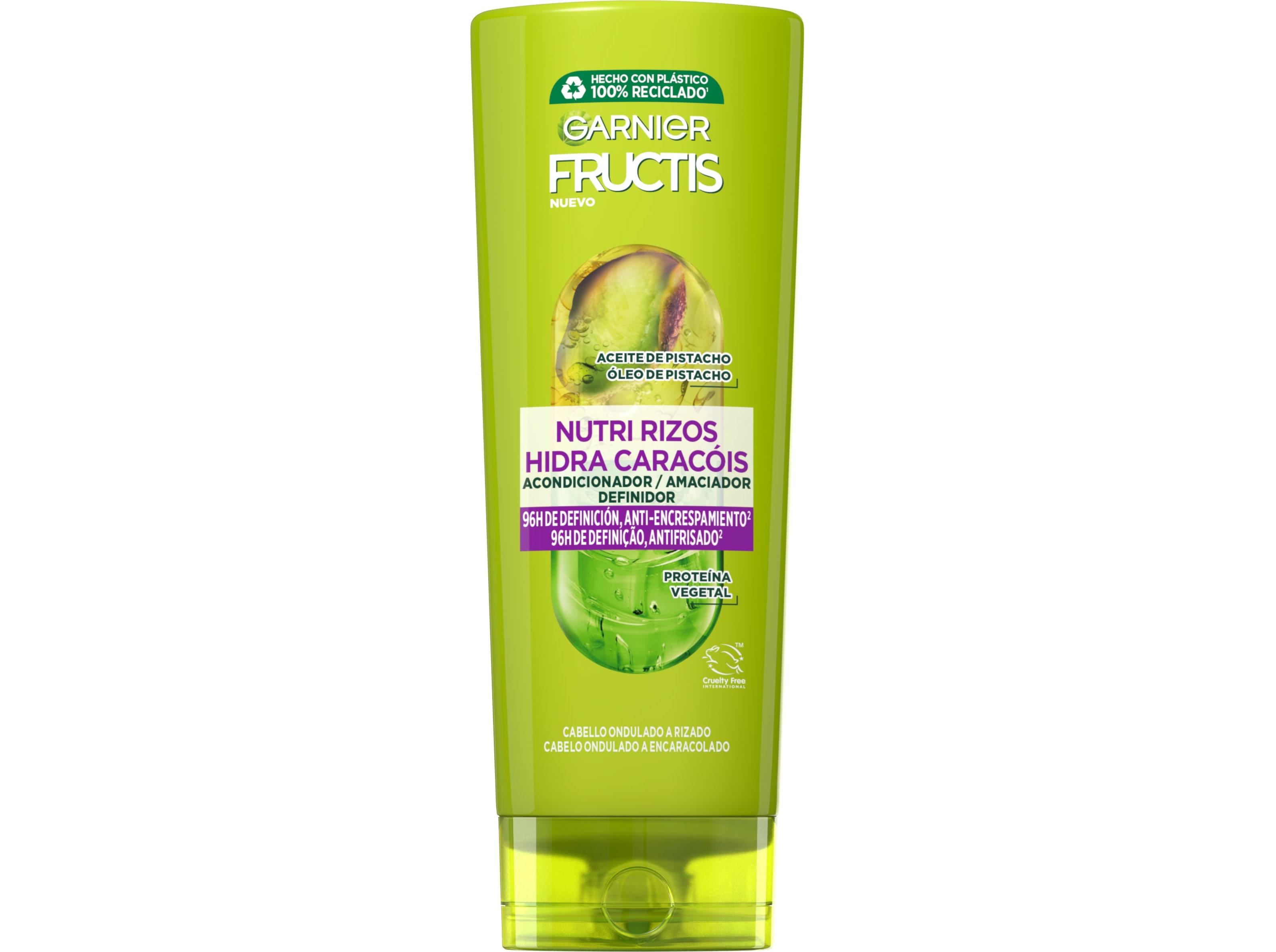 Green plastic tube of Garnier Fructis Nutri Rizos Conditioner, 250 ml, featuring purple text and a pistachio oil graphic, designed for enhancing and moisturizing curly hair.