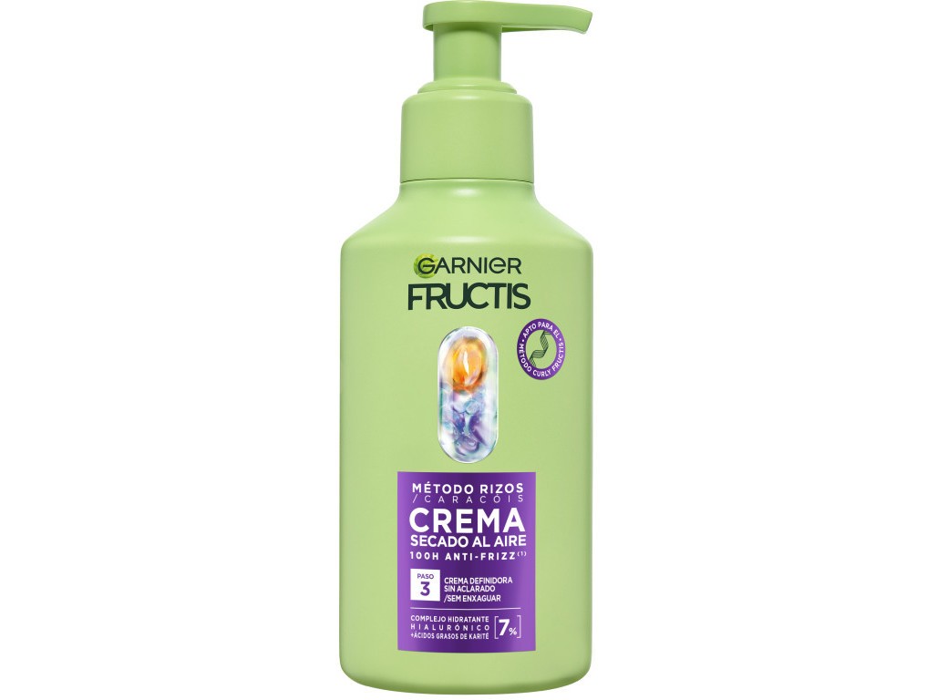 Light green plastic bottle of Garnier Fructis Curl Cream, 260ml, featuring a purple label with text in Spanish, and a colorful swirl design on the cap.