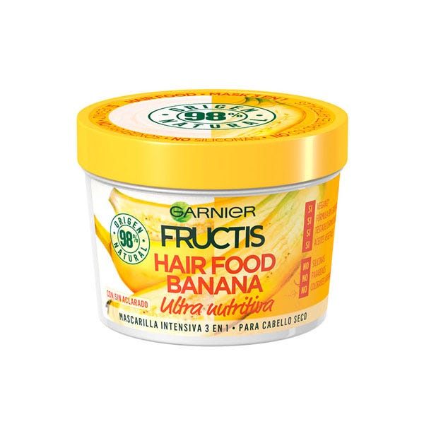 Yellow circular container with a bright yellow lid, labeled "Garnier Fructis Hair Food Banana Mask Ultra Nourishing," featuring banana graphics and a 390 ml capacity.