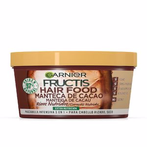 Garnier Fructis Hair Food Curl Nutrient Mask in a brown tub, featuring a cocoa butter label, highlighting its nourishing properties for curly hair.