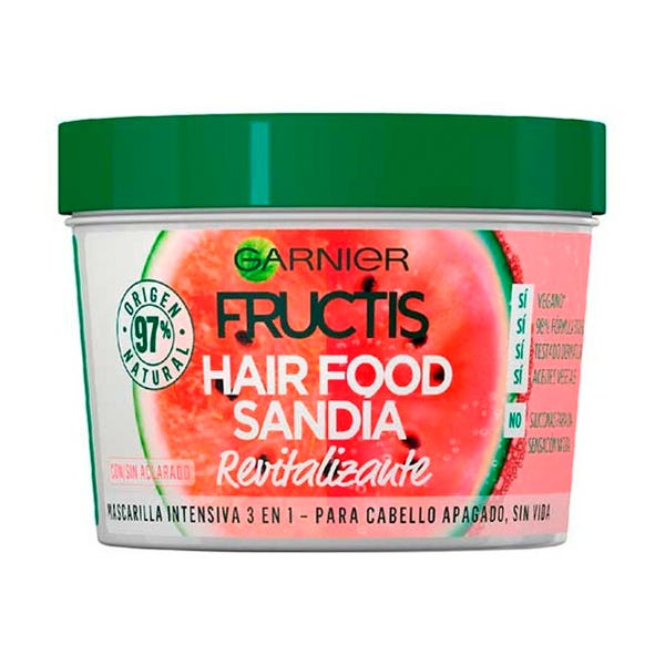 Green-lidded container of Garnier Fructis Hair Food Revitalizing Watermelon Mask, featuring a vibrant pink watermelon design and labeled for revitalizing dull hair.