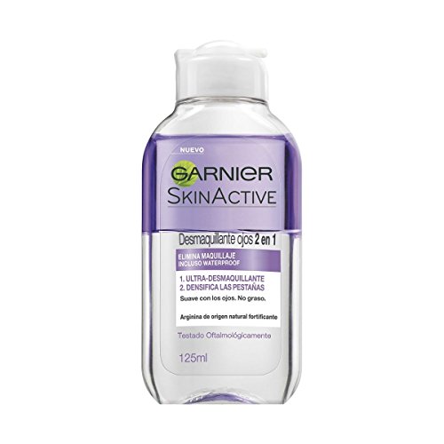 Clear plastic bottle with a purple label, featuring "Garnier SkinActive" branding, containing 125 ml of eye makeup remover, designed for waterproof makeup removal.