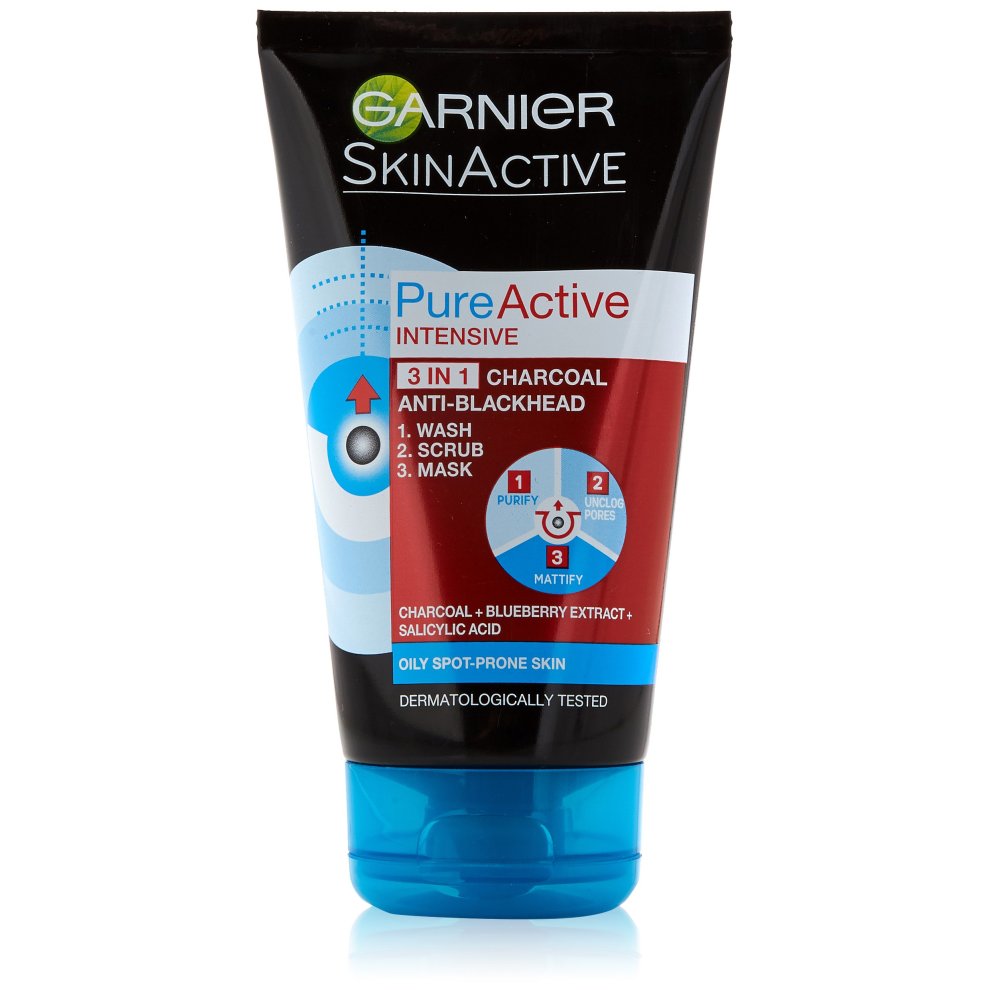 Black squeeze tube of Garnier Pure Active Intensive Charcoal 3 in 1 Wash, featuring a blue cap, with labels indicating its uses: wash, scrub, and mask for oily, spot-prone skin.
