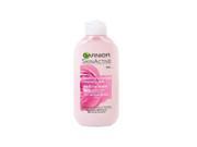 Pink bottle of Garnier Skin Active Soothing Botanical Cleansing Milk, featuring rose water, with a white cap and a label displaying product details and branding.