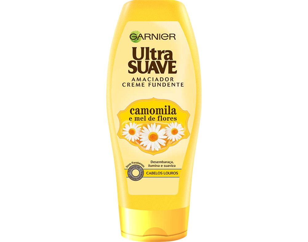 Yellow plastic bottle of Garnier Ultra Suave Conditioner, 400ml, featuring a floral design with chamomile and honey, emphasizing softness and shine for blonde hair.