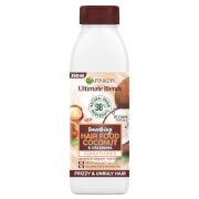 White bottle with a brown cap, featuring a label that highlights "Garnier Ultimate Blends Smoothing Hair Food Conditioner," with coconut and shea illustrations, 350ml size.