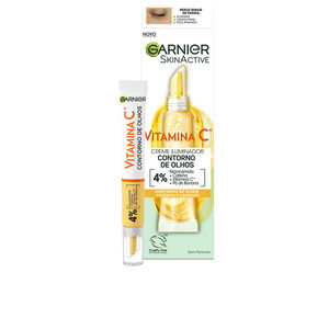 Illuminating Eye Contour Cream in a white and yellow tube with a gold cap, featuring "Vitamin C" prominently on the label, set against a light background.