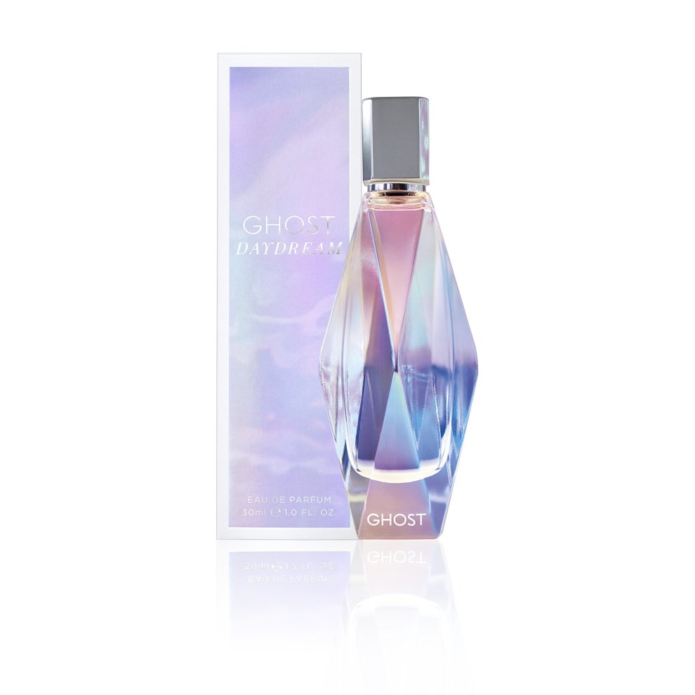Ghost Daydream perfume in a faceted glass bottle with an iridescent finish, accompanied by a pastel-colored box featuring the brand name and product details.