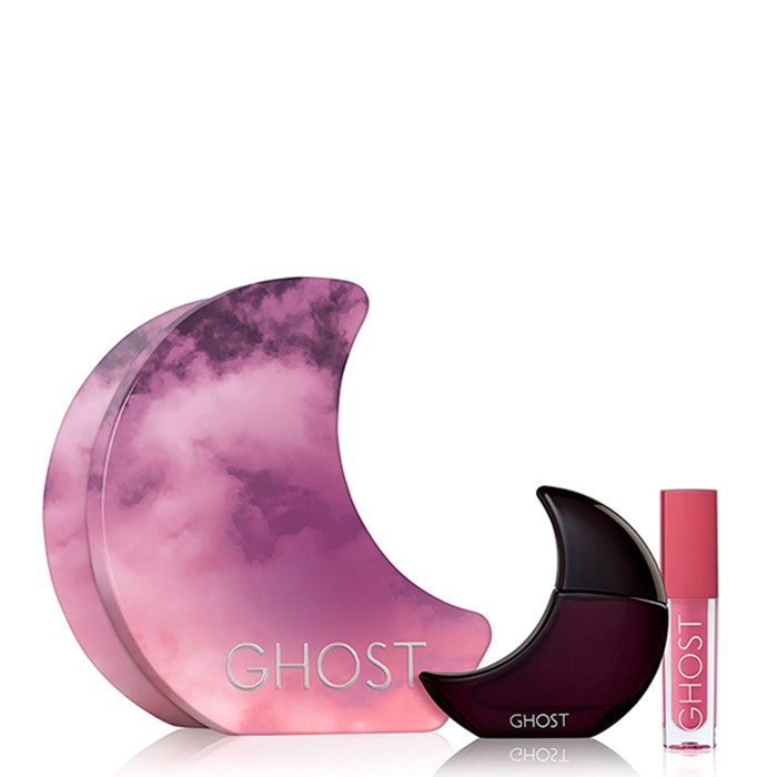 Gift set featuring a crescent-shaped box in purple and pink hues, containing a dark purple 10ml EDT bottle and a 1.5ml dusky rose lip gloss with a pink applicator.