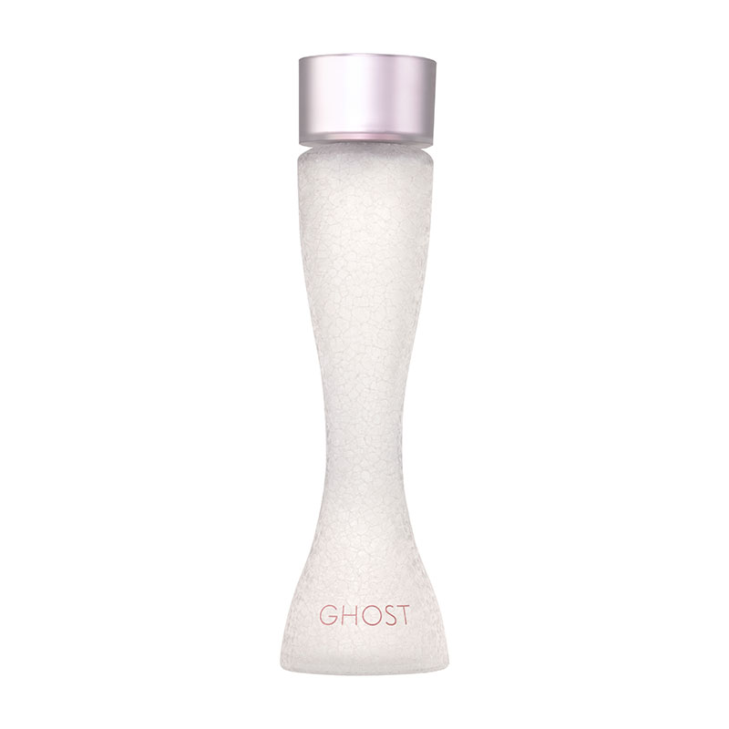 Clear, frosted glass bottle with a unique hourglass shape, featuring a pale pink cap and "GHOST" logo in soft pink at the base.