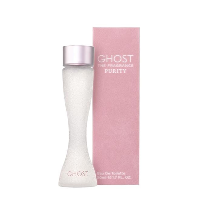 Clear glass bottle with a curvy shape, filled with white liquid, topped with a silver cap; accompanied by a pink box featuring the brand name "GHOST" and "PURITY" in elegant lettering.