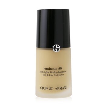 Luminous Silk Foundation in a sleek glass bottle with a black cap, featuring the Giorgio Armani logo and a light beige liquid inside, labeled for perfect glow and flawless finish.