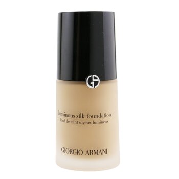 Luminous Silk Foundation by Giorgio Armani in a sleek glass bottle, featuring a black cap and the brand's logo, with a light beige liquid visible inside.