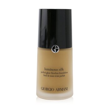 Luminous Silk Foundation in a 30ml glass bottle with a sleek black cap, featuring a gold and black label, showcasing a warm beige shade.