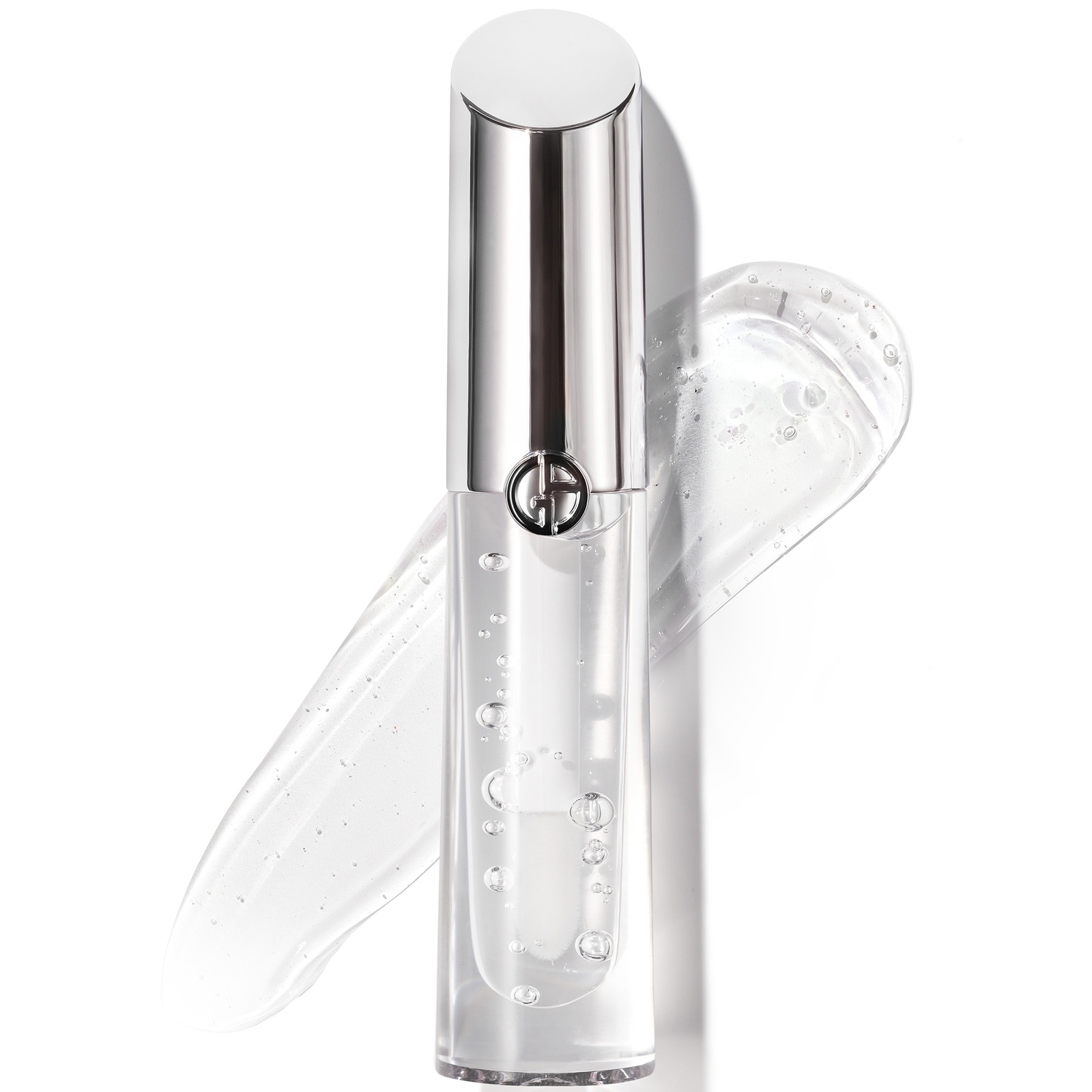 Clear glass lip gloss tube with a sleek silver cap and the Giorgio Armani logo, accompanied by a glossy, transparent swatch of the product.
