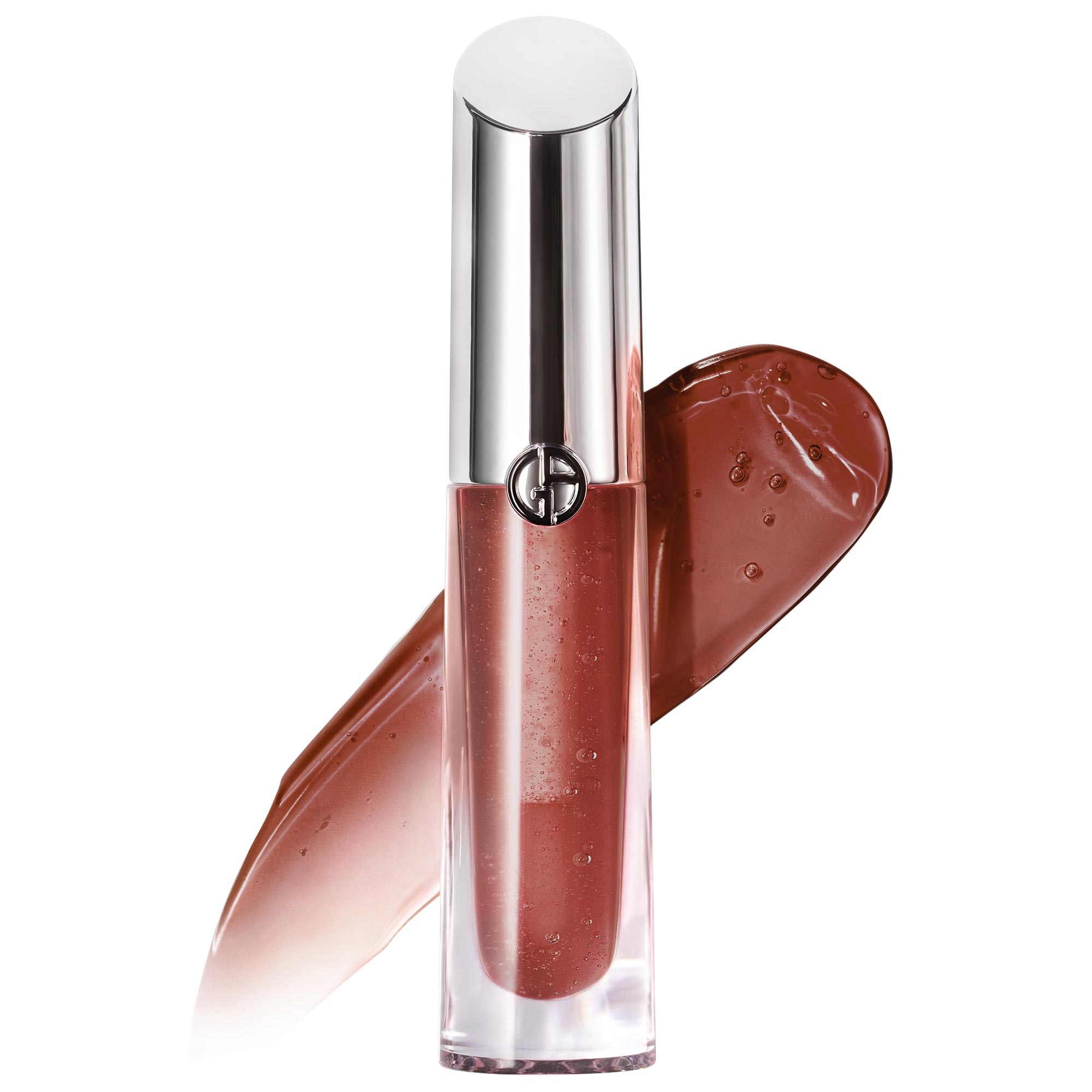 Armani Prisma Glass Lip Gloss features a sleek, transparent tube with a silver cap, showcasing a shimmering, warm brown gloss alongside a swatch of the same shade.