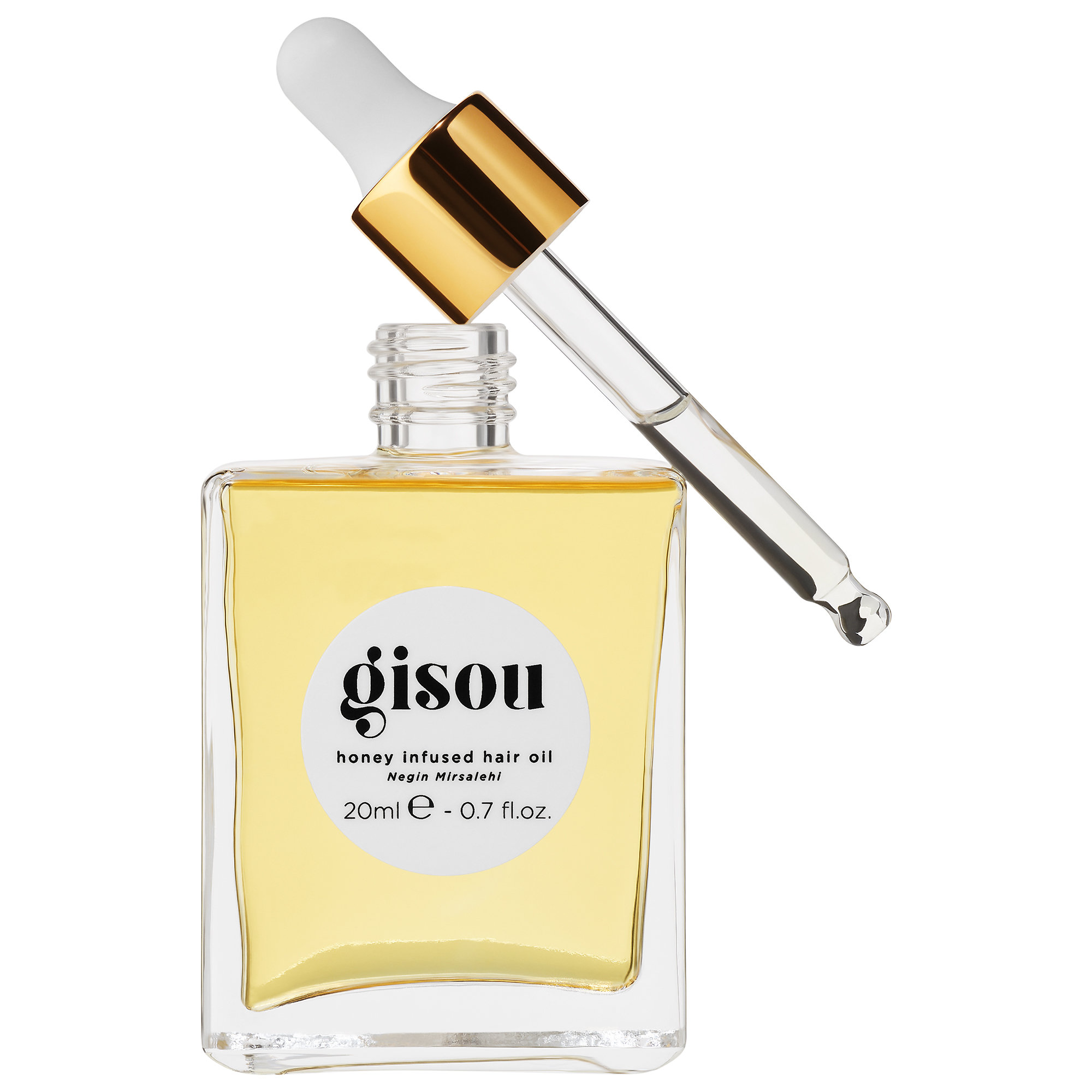 Clear glass bottle with a square shape, featuring a white label with black text "gisou," filled with golden honey-infused hair oil and topped with a gold dropper cap.