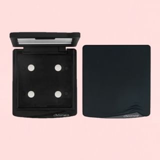 Black 4-compartment palette tray with a smooth surface, featuring four circular wells for product placement, designed for easy organization and portability.