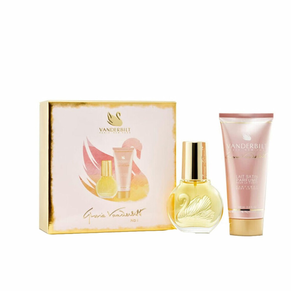 Two-piece gift set featuring a 1oz EDT spray in a swan-shaped bottle and a 3.4oz body lotion, packaged in a pink and gold box with a floral design.