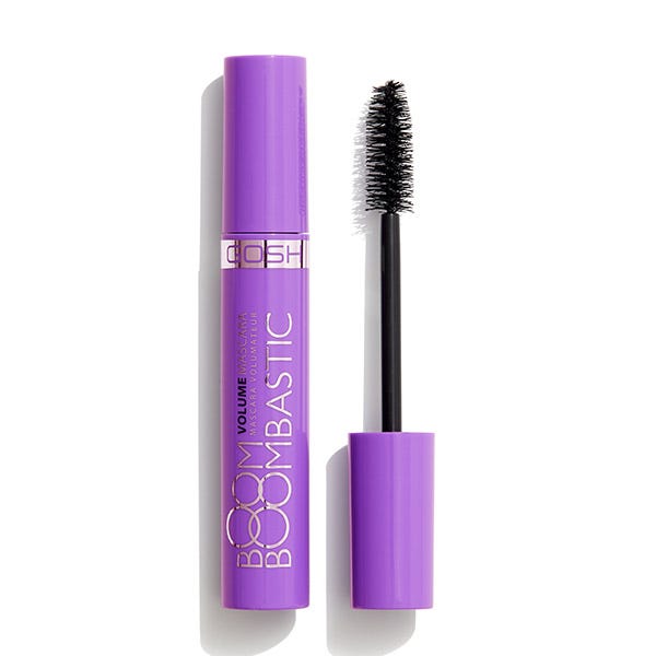Gosh Boombastic Volume Mascara in a vibrant purple tube, featuring bold white text, accompanied by a black bristle wand for enhancing lash volume.