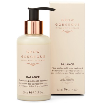 Cream-colored bottle with a pump dispenser, featuring a rose gold label, alongside a matching box, labeled "Grow Gorgeous Balance FibreSealing Split Ends Treatment 5 Fl. Oz."