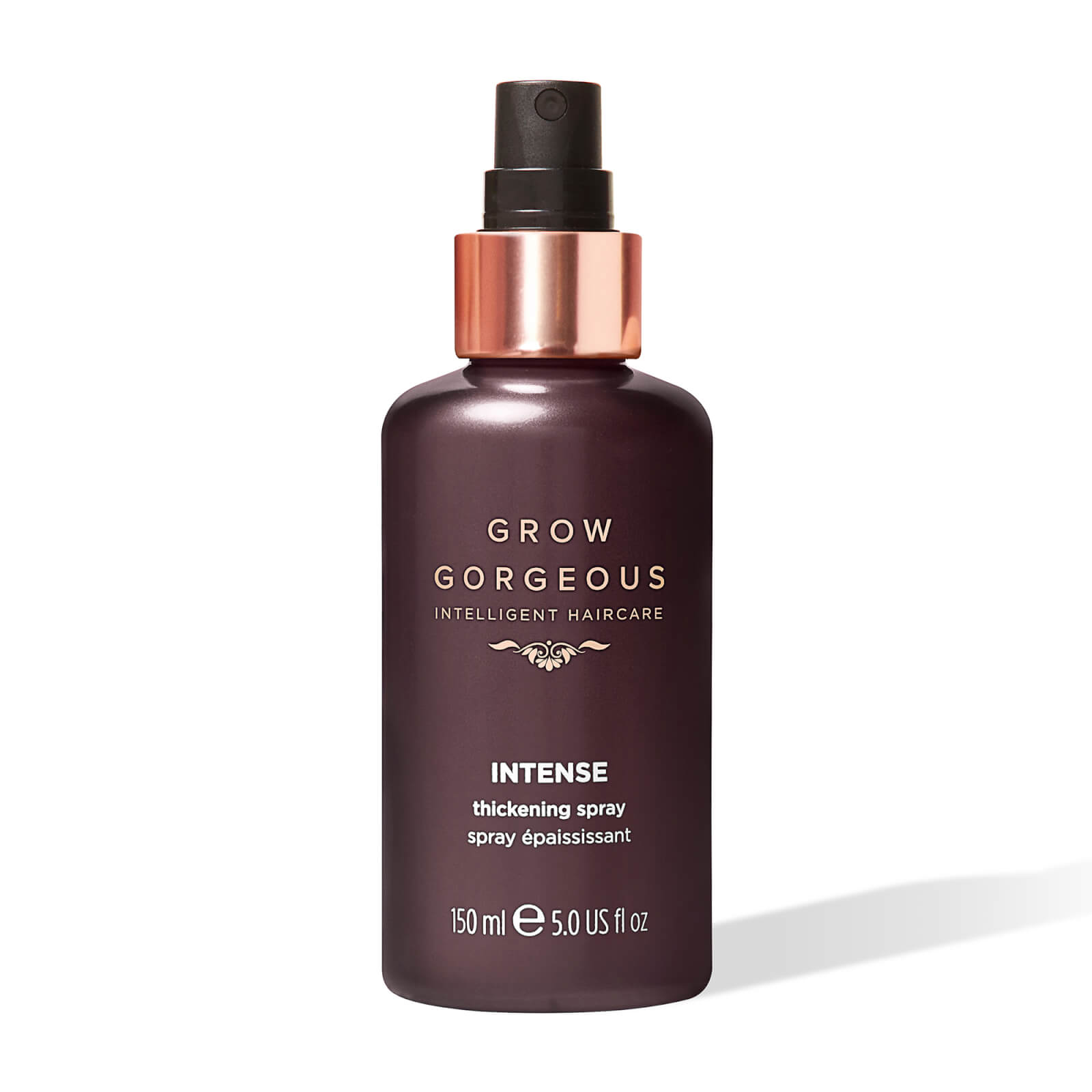 Debenhams Grow Gorgeous Intense Thickening Spray in a dark purple bottle with a rose gold pump, labeled with gold text, 150 ml size.