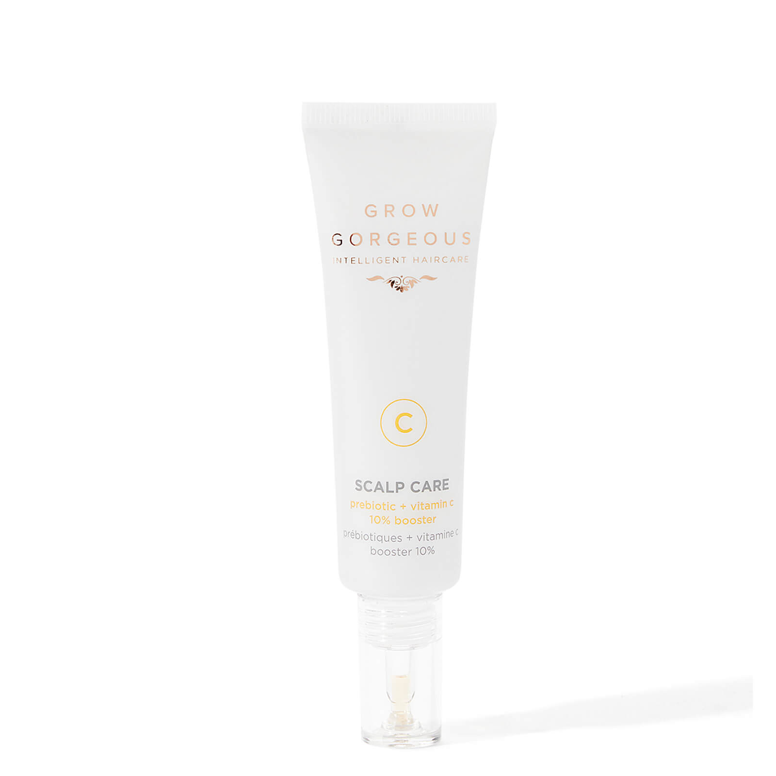White tube with gold accents, labeled "Grow Gorgeous," featuring "Scalp Care" and "Prebiotic + Vitamin C 10% Booster," with a clear applicator tip at the end.