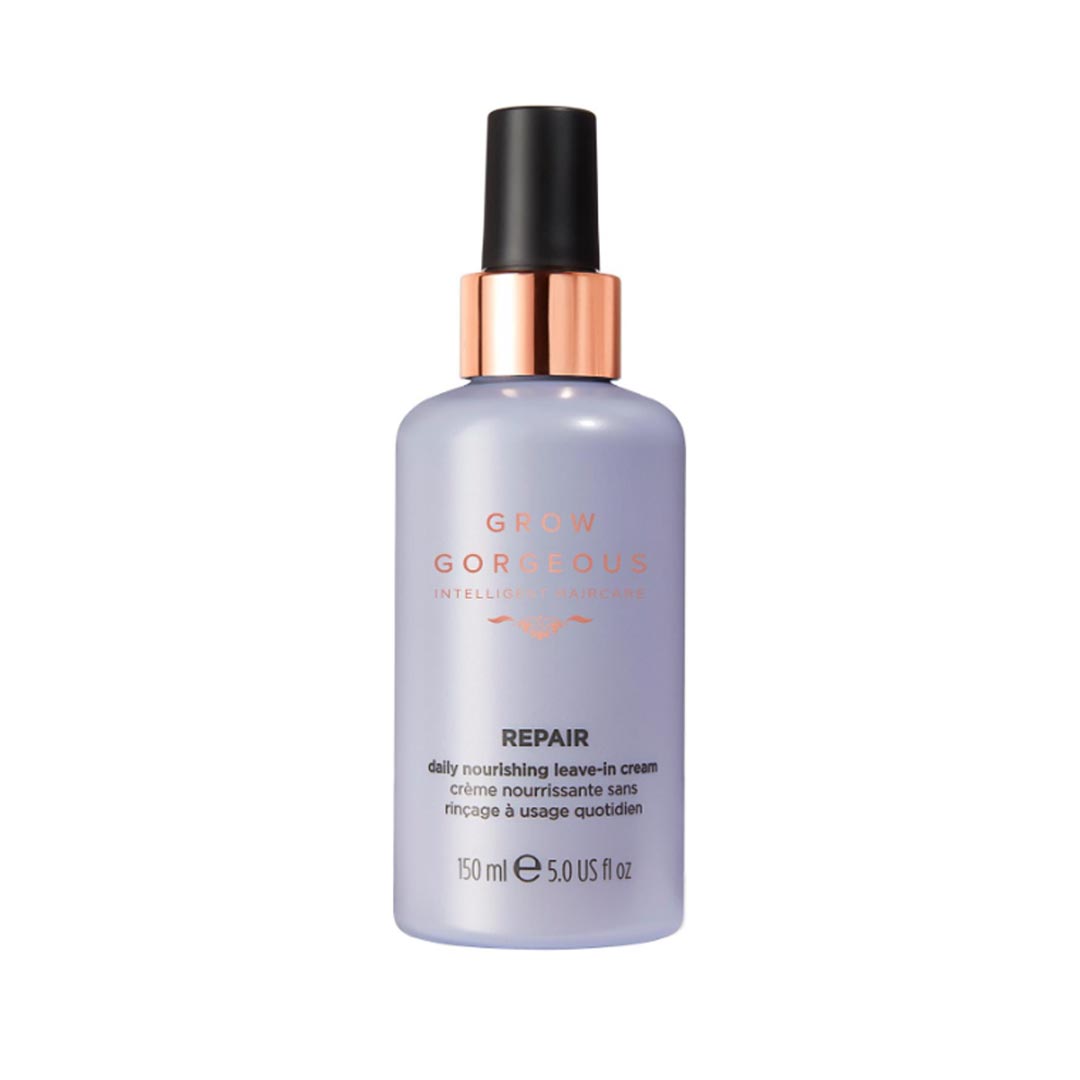 Lavender-colored bottle with a black pump top and rose gold accents, labeled "Grow Gorgeous Repair" for daily nourishing leave-in cream, 150ml.