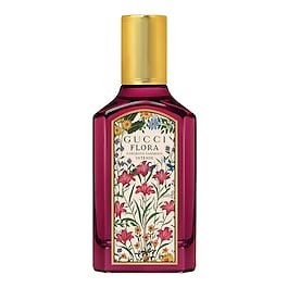 Gucci Flora Gorgeous Gardenia Eau De Parfum Intense features a vibrant fuchsia bottle with a floral design and a gold cap, showcasing a luxurious and elegant aesthetic.