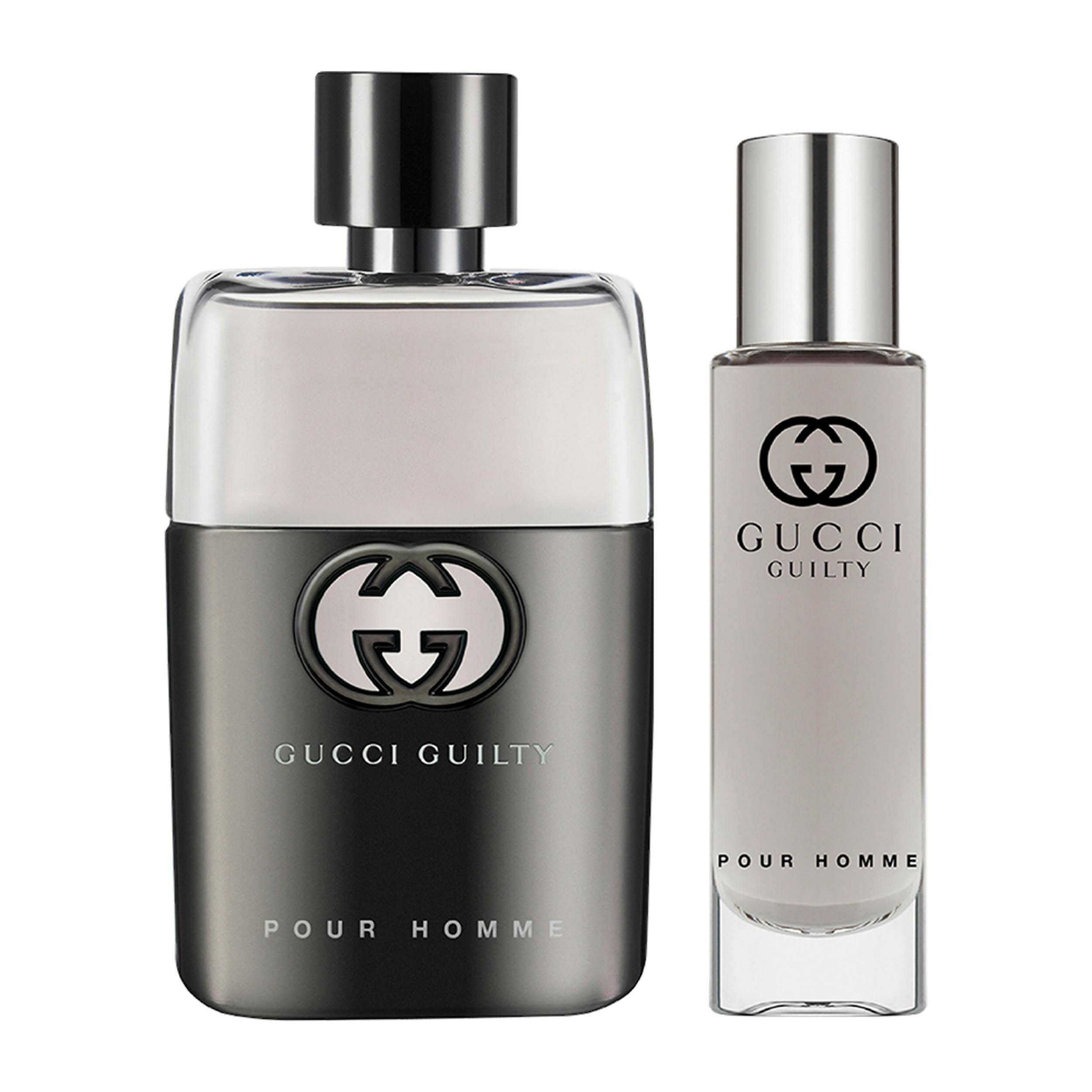 Gucci Guilty Pour Homme gift set featuring a 50ml Eau de Toilette bottle with a sleek black and silver design, accompanied by a smaller travel-sized spray.